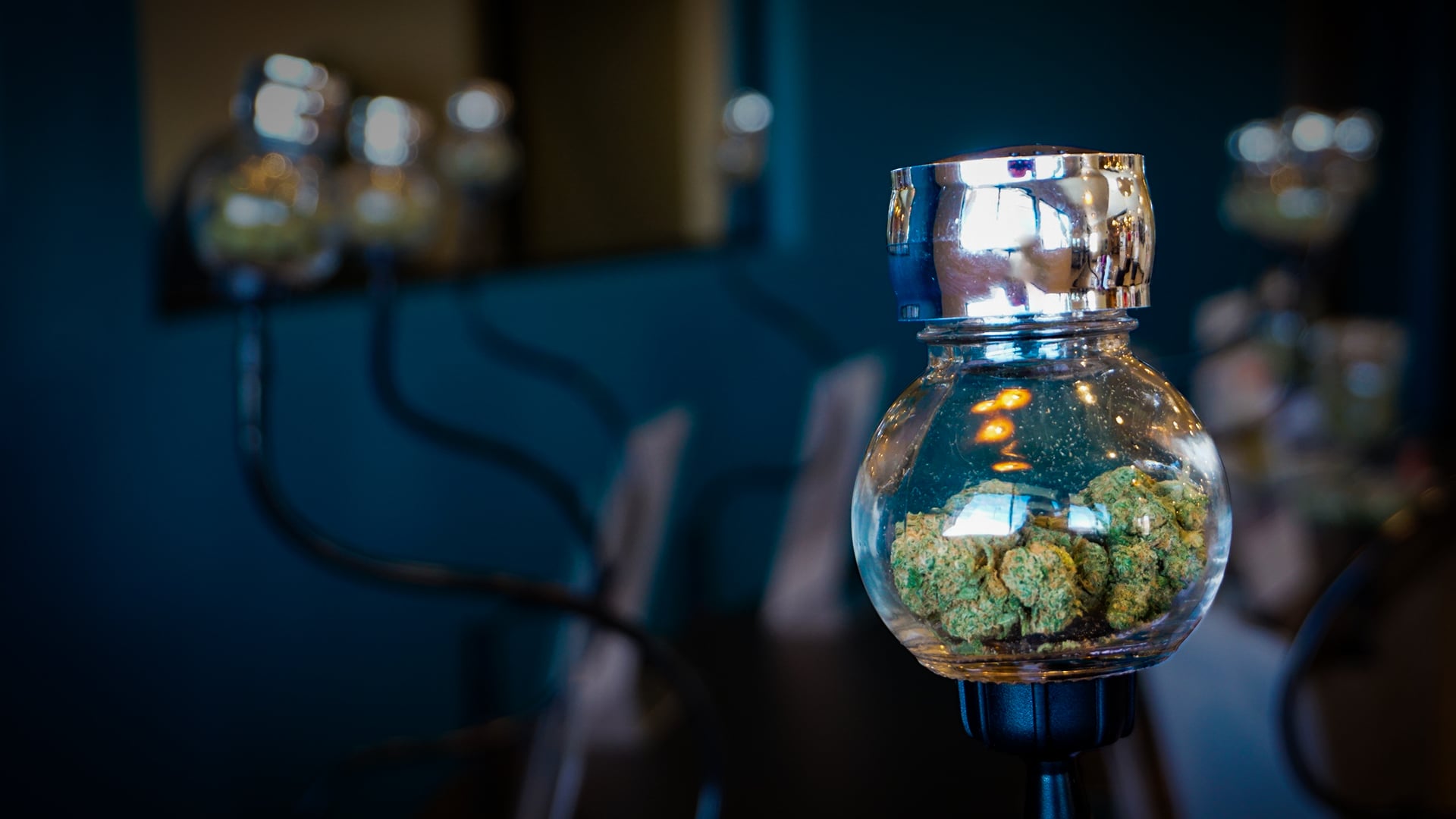 Cannabis flower displayed in glass jars at Fountain Superstore dispensary in Colorado Springs.
